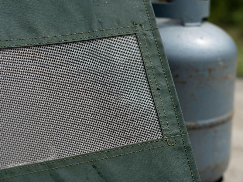 Ventilation mesh detail sewn into a gas bottle cover